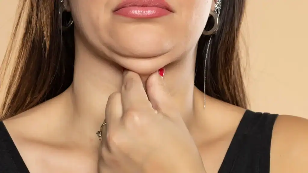 An image of a woman with double chin, sad, worried : Non Surgical Double Chin Removal Treatment in Underwood, UK