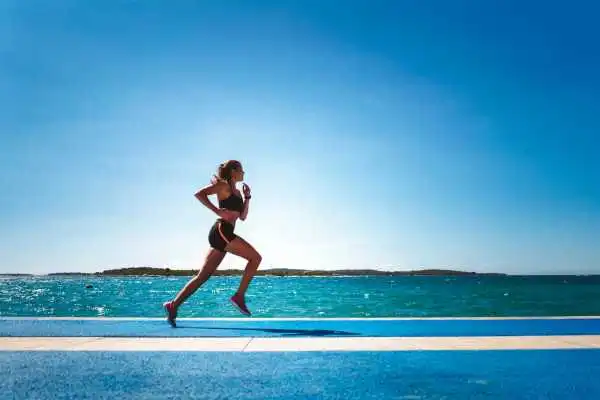 Woman running showing strong leg muscle Underwood